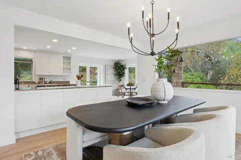 a kitchen with a table and chairs