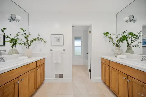 a bedroom with bed couch and window
