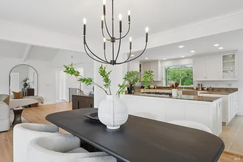 a kitchen with a table and chairs