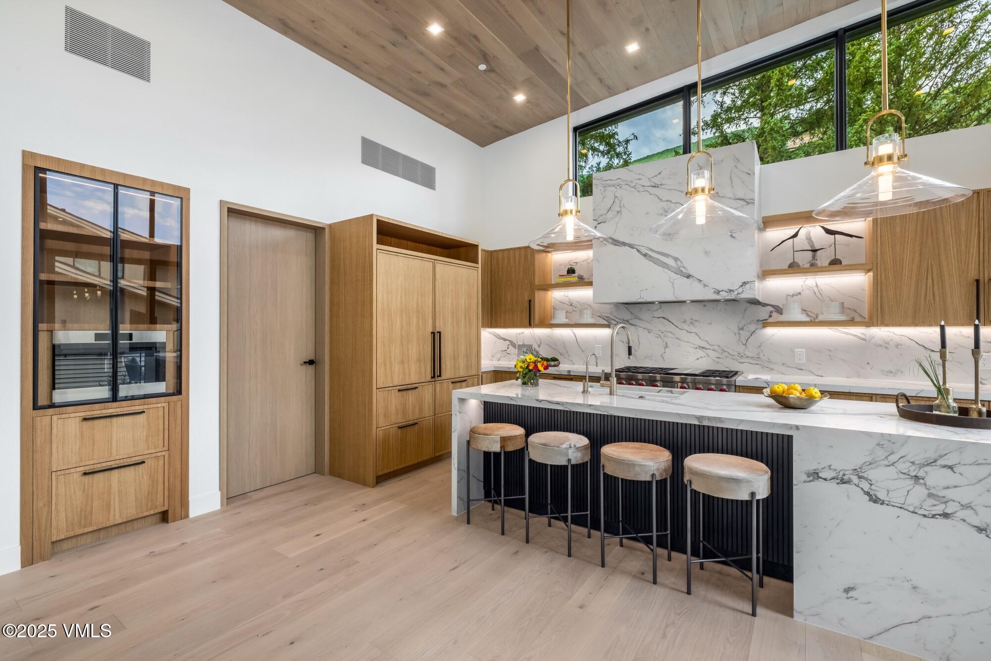 1489 Vail Valley Drive Vail, CO 81657 - Photo 12 of 56 a kitchen with a stove a refrigerator and a stove
