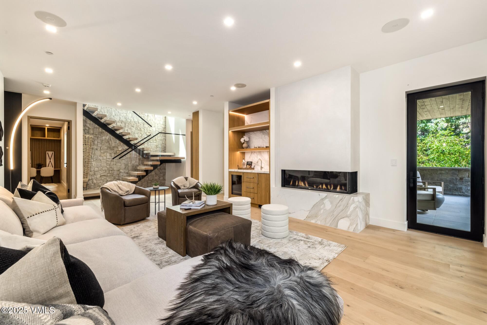 1489 Vail Valley Drive Vail, CO 81657 - Photo 29 of 56 a living room with furniture and a flat screen tv