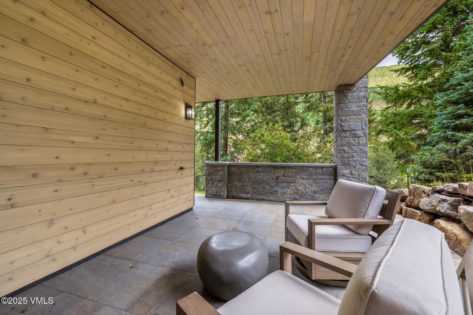 1489 Vail Valley Drive Vail, CO 81657 - Photo 34 of 56 a backyard of a house with seating space