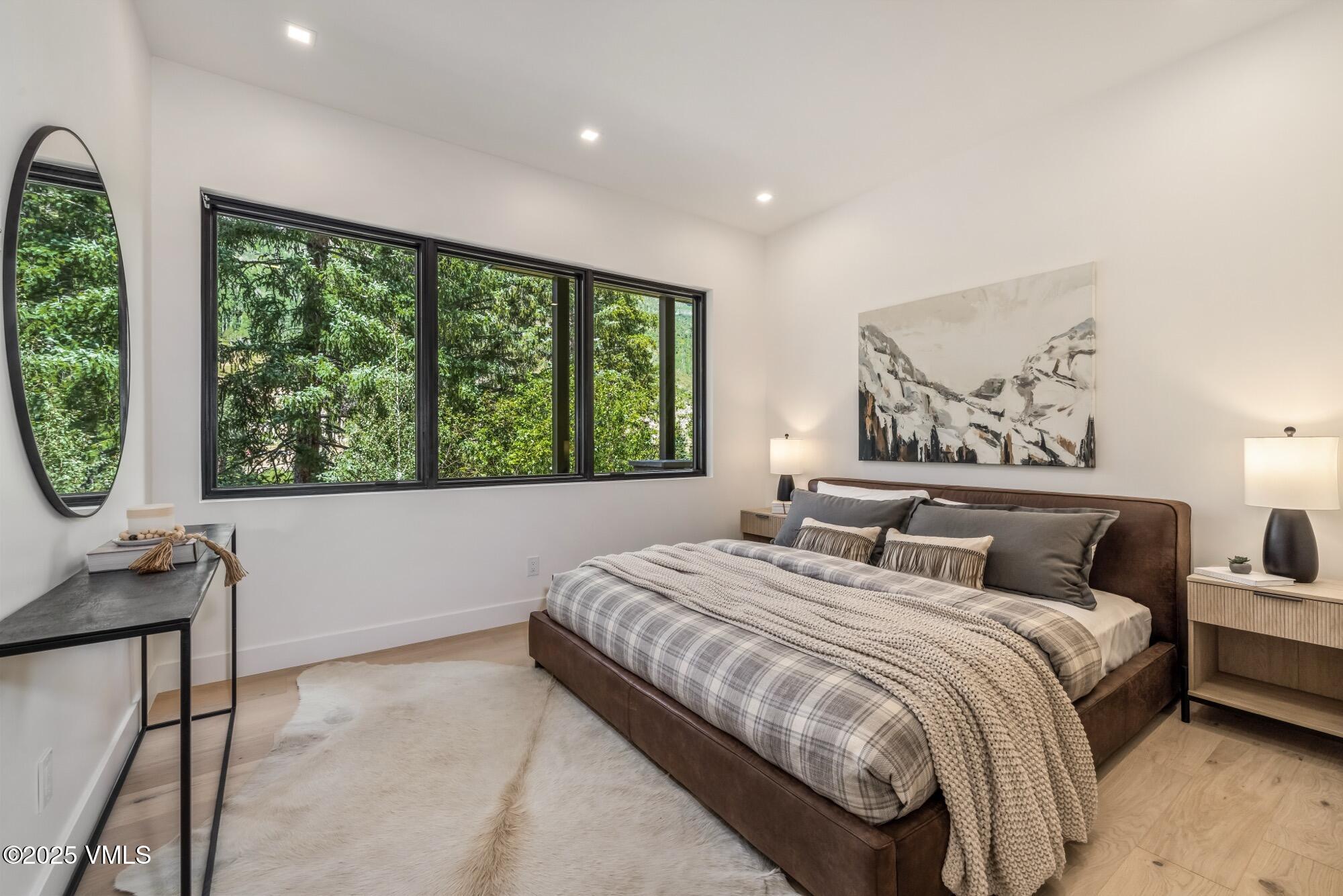 1489 Vail Valley Drive Vail, CO 81657 - Photo 36 of 56 a bedroom with a large bed and a window