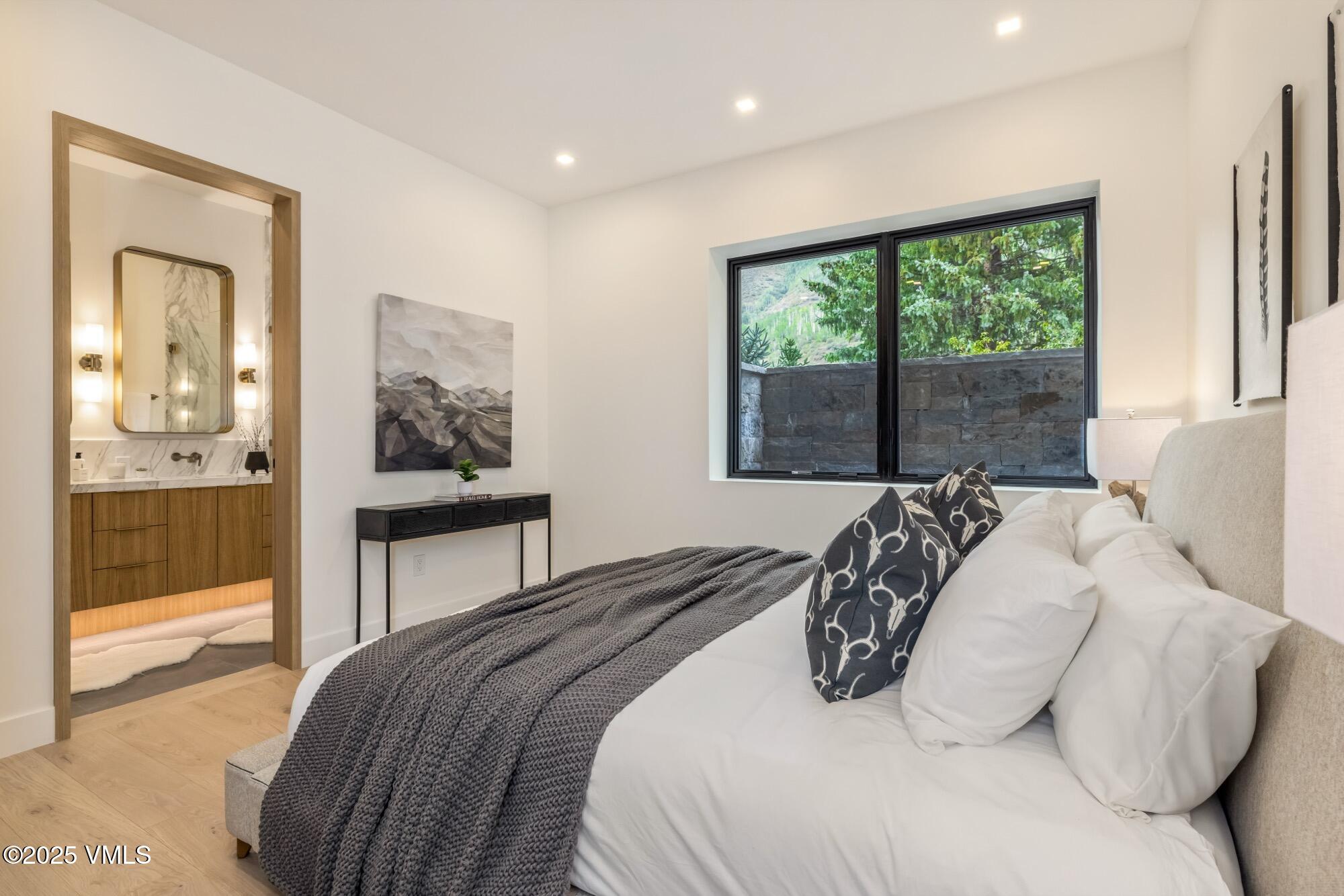 1489 Vail Valley Drive Vail, CO 81657 - Photo 43 of 56 a bedroom with a bed and a large window