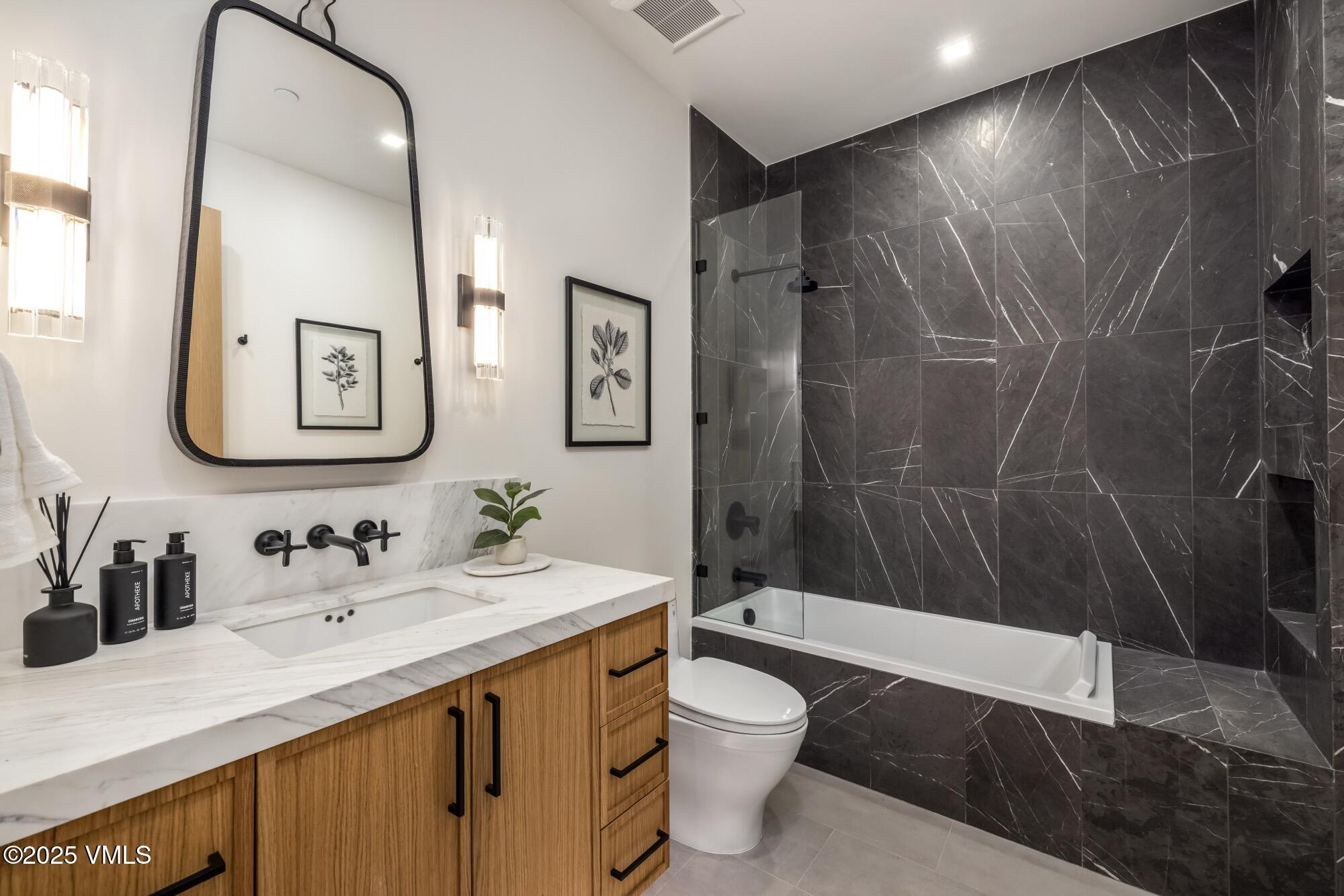 1489 Vail Valley Drive Vail, CO 81657 - Photo 46 of 56 a bathroom with a sink a toilet and shower