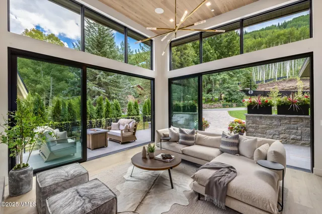 a kitchen with granite countertop a table chairs stove and wooden floor