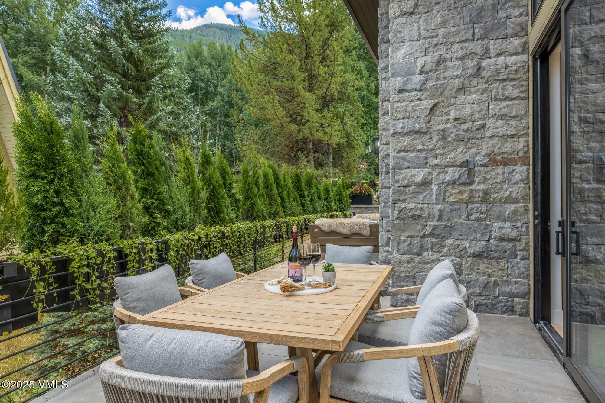 1489 Vail Valley Drive Vail, CO 81657 - Photo 8 of 56 a outdoor dining space with furniture and outdoor view