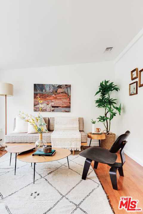 4539 Rising Hill Road Altadena, CA 91001 - Photo 12 of 27 a living room with furniture a rug and a potted plant
