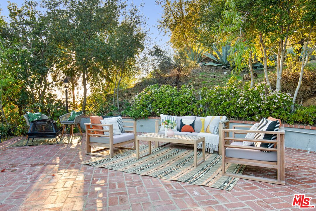 4539 Rising Hill Road Altadena, CA 91001 - Photo 19 of 27 a view of a tables and chairs in a patio