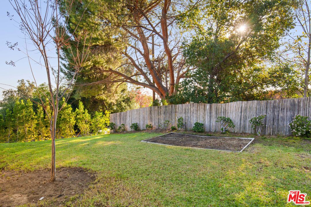 4539 Rising Hill Road Altadena, CA 91001 - Photo 22 of 27 a backyard of house with swing and slide
