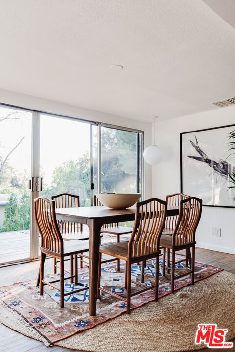 4539 Rising Hill Road Altadena, CA 91001 - Photo 4 of 27 a view of a chairs and table in the patio