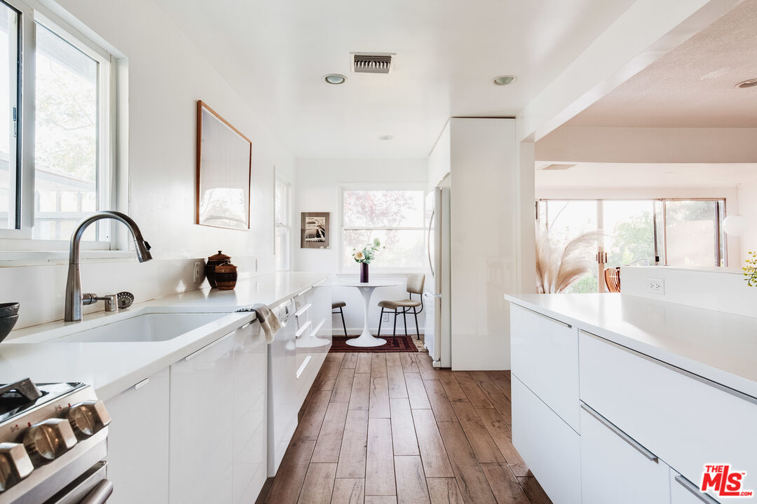 4539 Rising Hill Road Altadena, CA 91001 - Photo 9 of 27 a view of a kitchen counter space with a sink and wooden floor