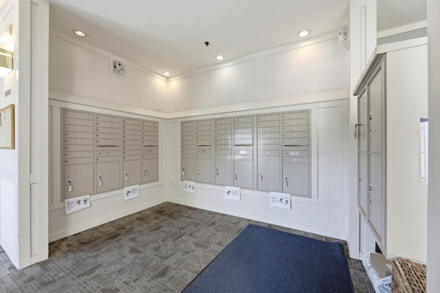 22330 Homestead Road, Unit 226 Cupertino, CA 95014 - Photo 32 of 38 an empty room with wooden floor and door