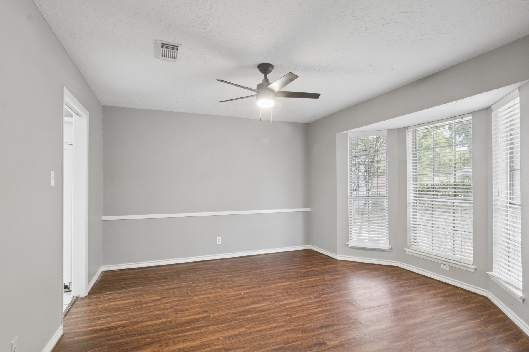 2607 Allyson Court Spring, TX 77373 - Photo 13 of 25 wooden floor in an empty room with a window