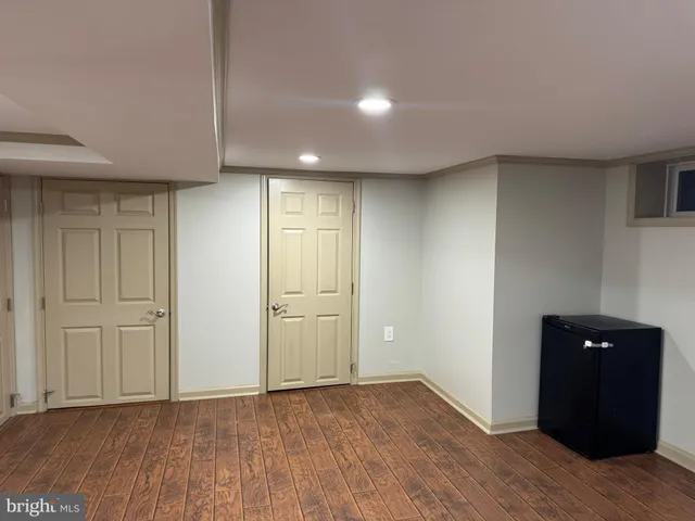 a view of a hallway and wooden floor