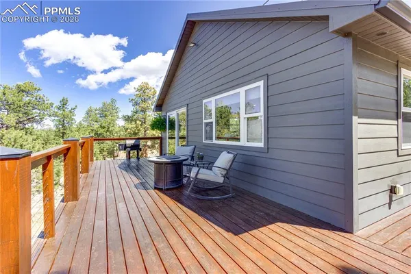 a view of a backyard with a tree
