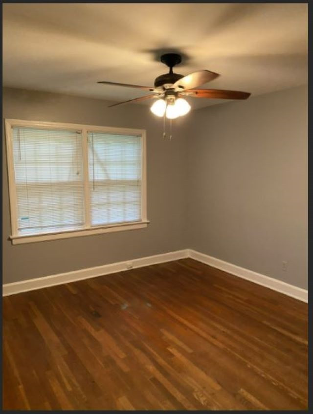3003 Medlin Drive Raleigh, NC 27607 - Photo 7 of 7 a view of an empty room with wooden floor and a window