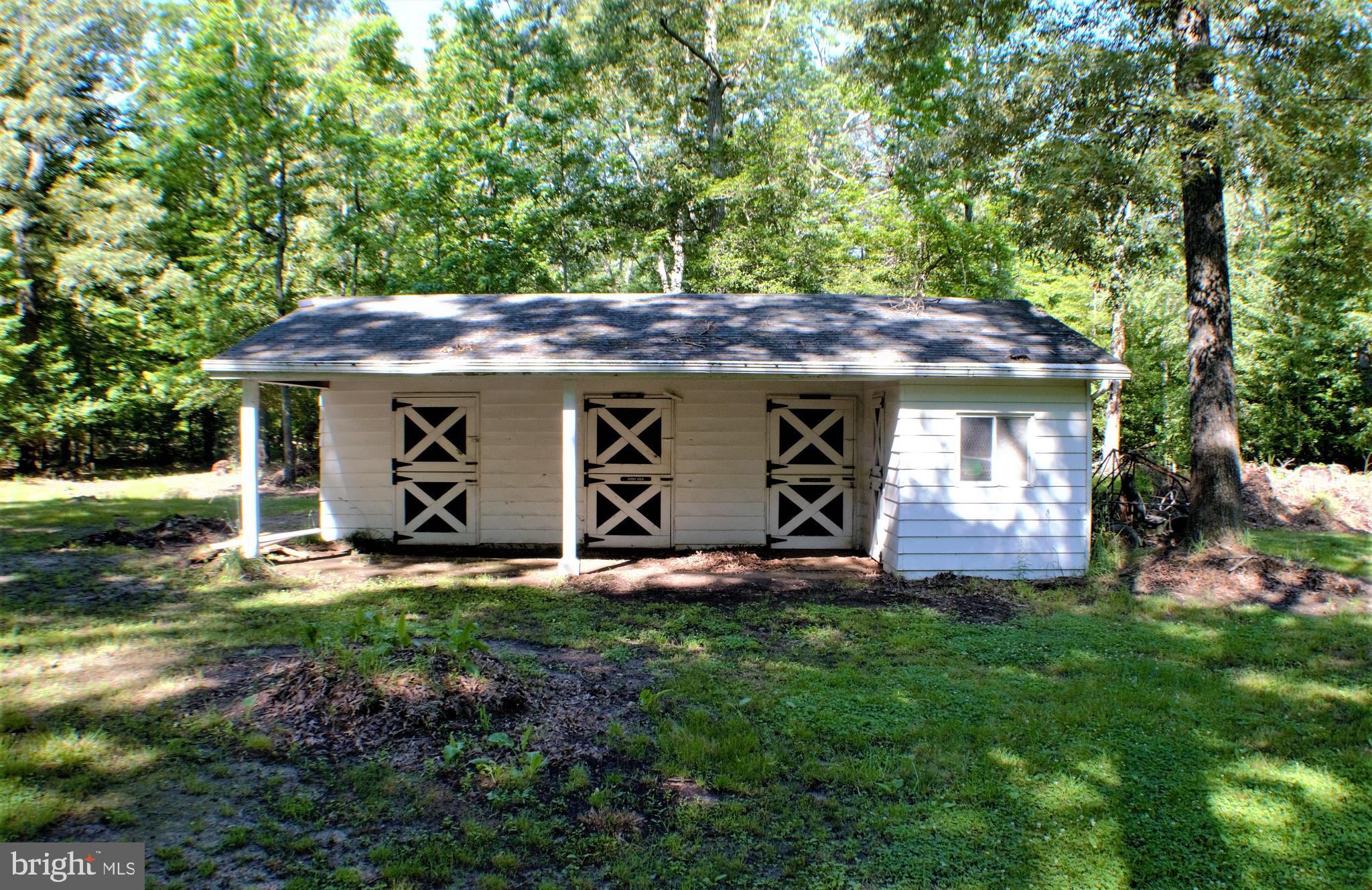 7050 Hawthorne Road La Plata, MD 20646 - Photo 41 of 68 Stable with three stalls and feed + storage area