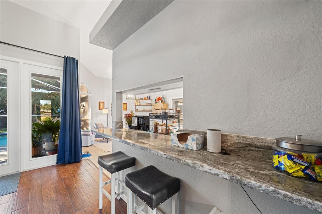 11180 Flock Avenue Weeki Wachee, FL 34613 - Photo 13 of 83 a living room with furniture and a flat screen tv