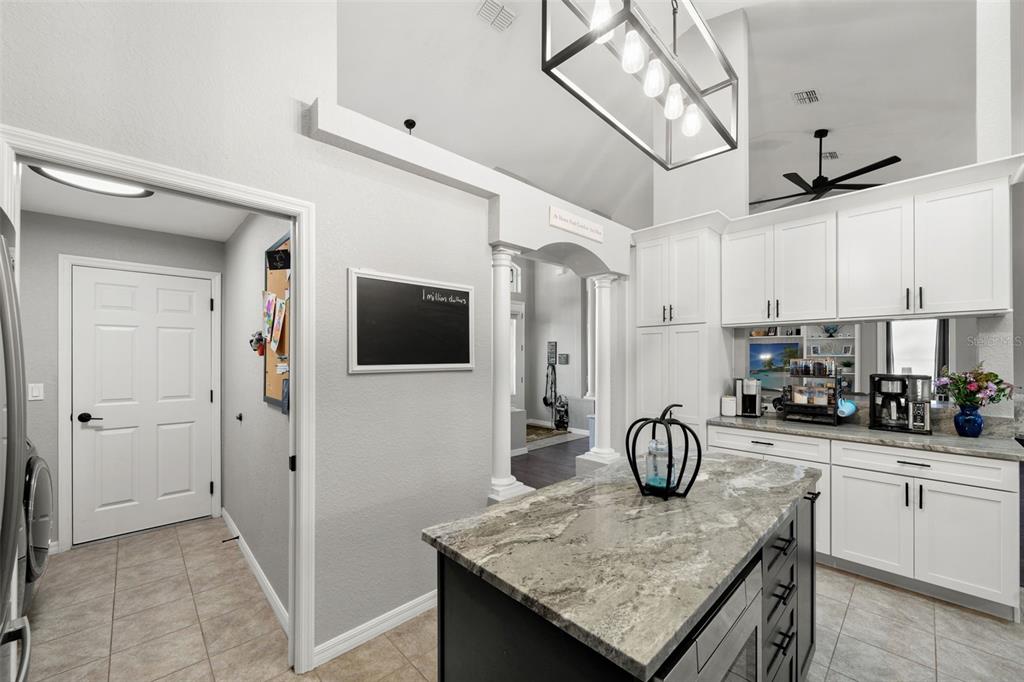 11180 Flock Avenue Weeki Wachee, FL 34613 - Photo 20 of 83 a kitchen with a sink a refrigerator and cabinets