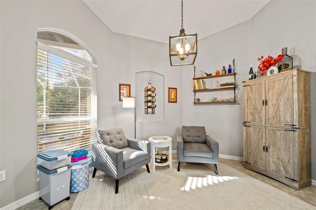 11180 Flock Avenue Weeki Wachee, FL 34613 - Photo 26 of 83 a living room with furniture and a window