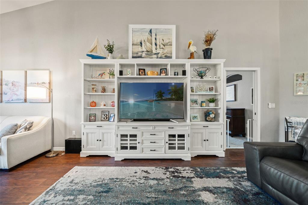 11180 Flock Avenue Weeki Wachee, FL 34613 - Photo 28 of 83 a living room with furniture and a flat screen tv