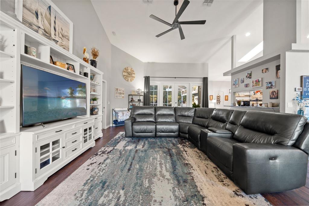 11180 Flock Avenue Weeki Wachee, FL 34613 - Photo 30 of 83 a living room with furniture and a flat screen tv