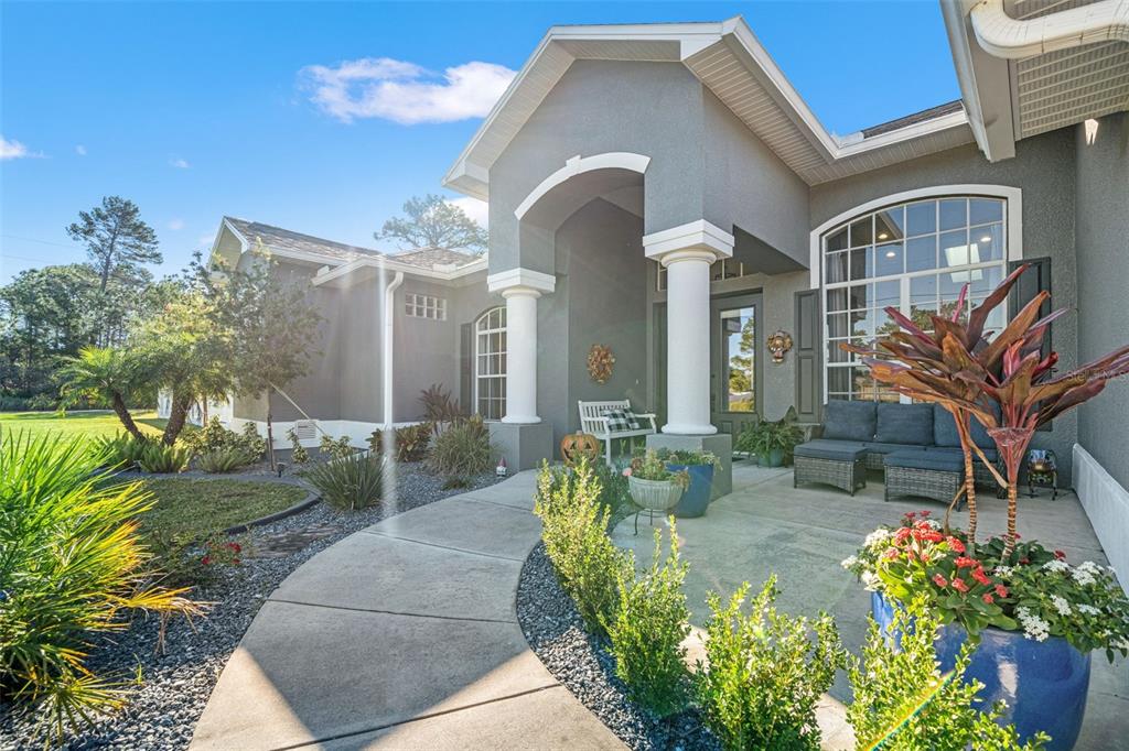 11180 Flock Avenue Weeki Wachee, FL 34613 - Photo 3 of 83 a front view of a house with garden