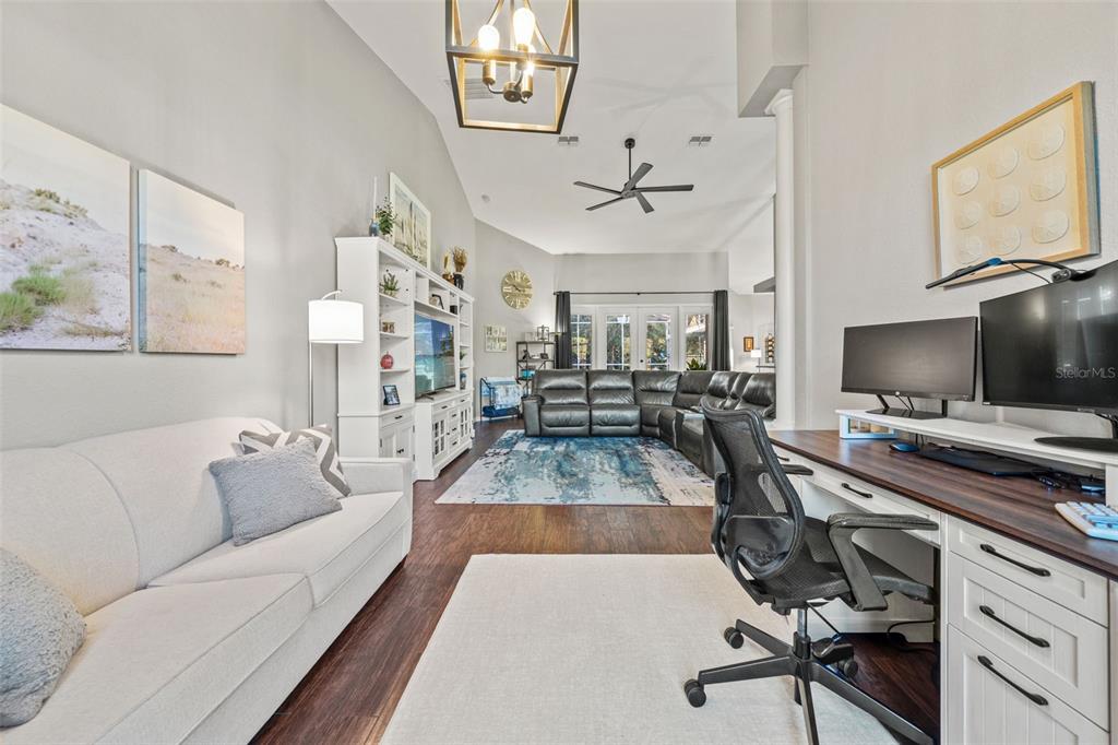 11180 Flock Avenue Weeki Wachee, FL 34613 - Photo 32 of 83 a view of living room filled with furniture and a flat screen tv