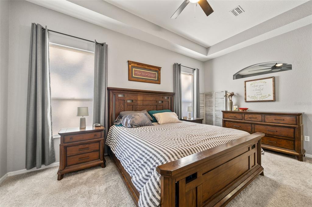 11180 Flock Avenue Weeki Wachee, FL 34613 - Photo 35 of 83 a bedroom with a bed and a dresser