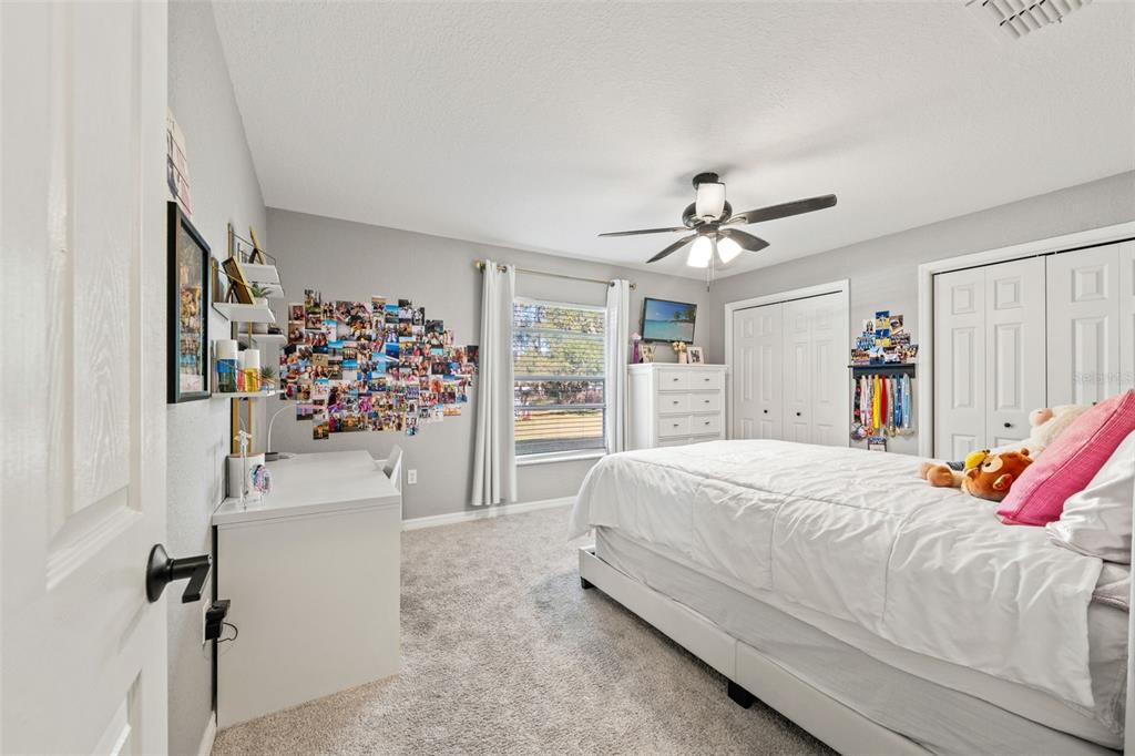 11180 Flock Avenue Weeki Wachee, FL 34613 - Photo 41 of 83 a bedroom with a bed and a window