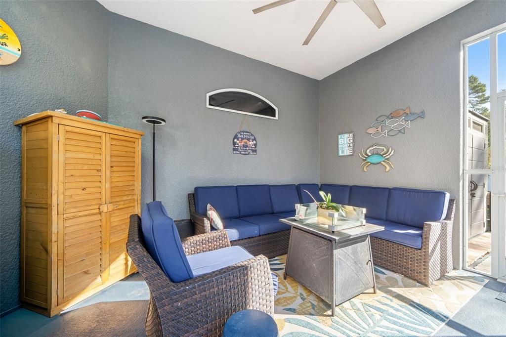 11180 Flock Avenue Weeki Wachee, FL 34613 - Photo 50 of 83 a living room with furniture and painting on the wall