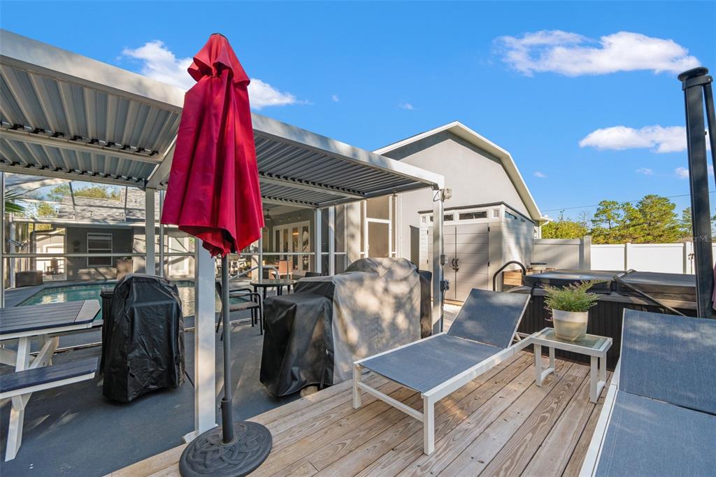 11180 Flock Avenue Weeki Wachee, FL 34613 - Photo 58 of 83 a view of a chairs and table in the patio