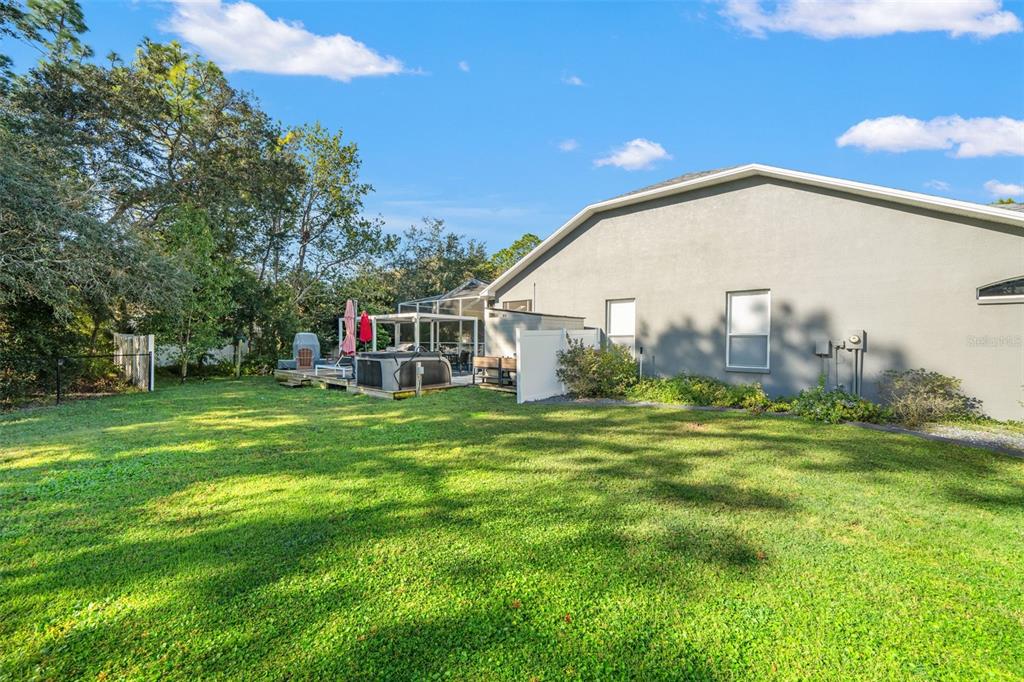 11180 Flock Avenue Weeki Wachee, FL 34613 - Photo 61 of 83 a view of a big house with a big yard and large trees
