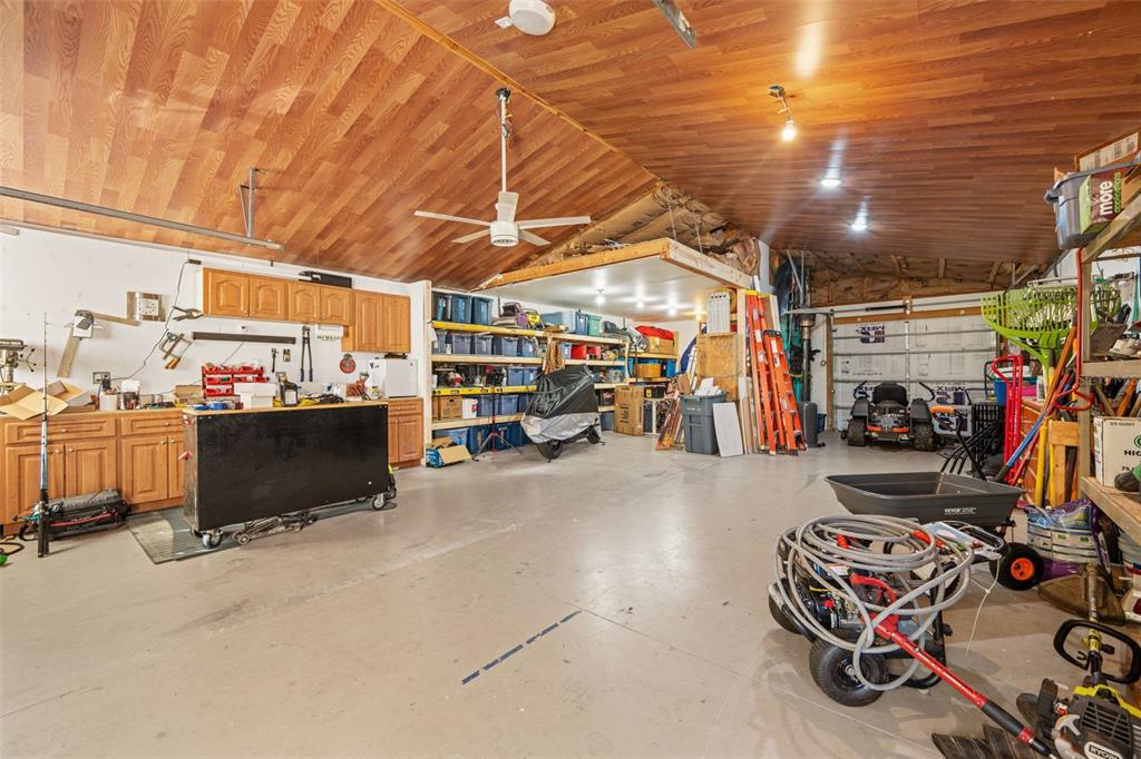 11180 Flock Avenue Weeki Wachee, FL 34613 - Photo 68 of 83 a view of a garage with storage