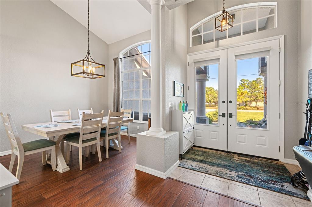 11180 Flock Avenue Weeki Wachee, FL 34613 - Photo 7 of 83 a living room with furniture wooden floor and a chandelier