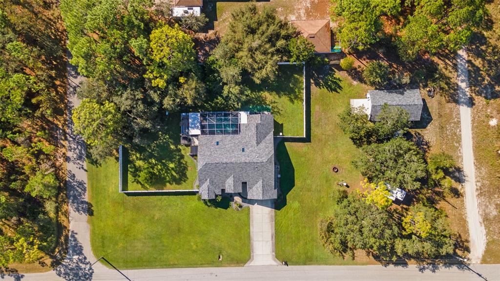 11180 Flock Avenue Weeki Wachee, FL 34613 - Photo 81 of 83 an aerial view of a house with a yard basket ball court and outdoor seating
