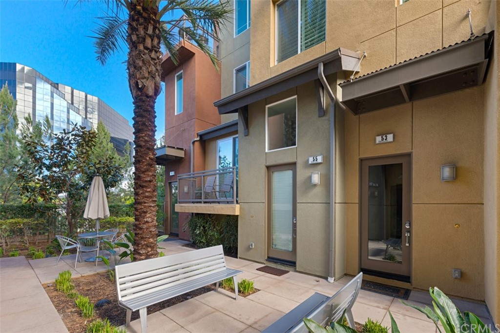 53 Waldorf Irvine, CA 92612 - Photo 11 of 28 a view of a patio with couches table and chairs and potted plants