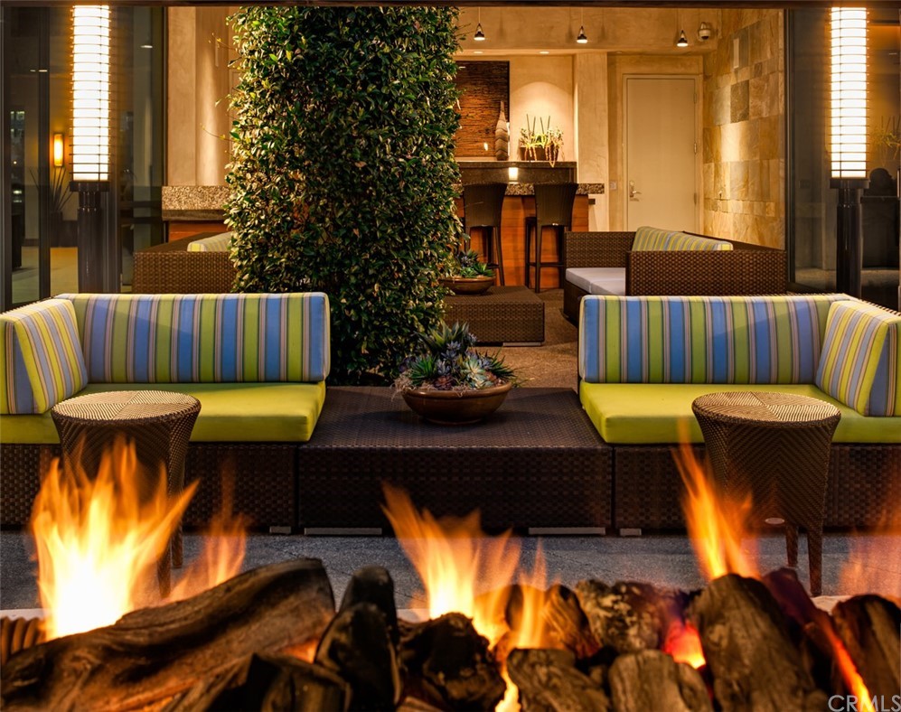 53 Waldorf Irvine, CA 92612 - Photo 14 of 28 a living room with furniture fireplace and a large window