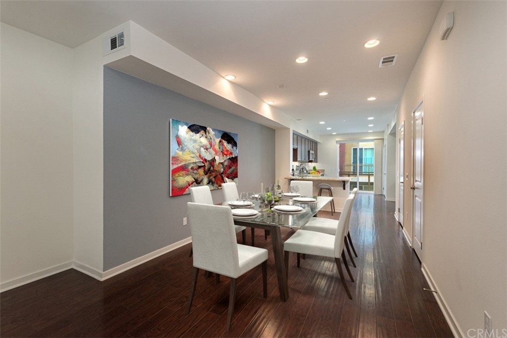 53 Waldorf Irvine, CA 92612 - Photo 3 of 28 a view of a dining room with furniture and wooden floor