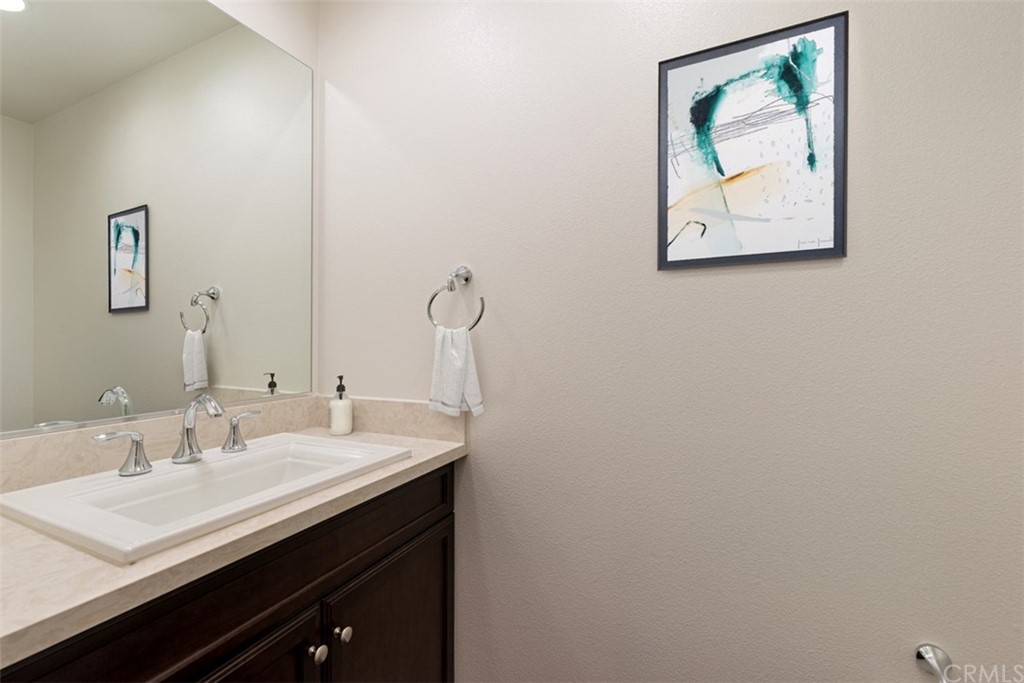 53 Waldorf Irvine, CA 92612 - Photo 4 of 28 a bathroom with a sink and a mirror