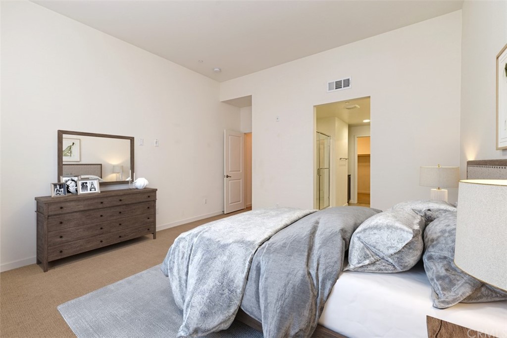 53 Waldorf Irvine, CA 92612 - Photo 7 of 28 a bedroom with a bed and a dresser