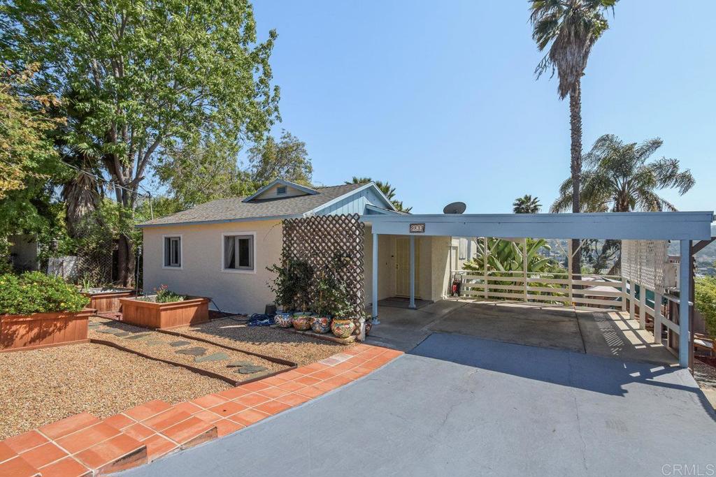 a front view of a house with yard patio and fire pit