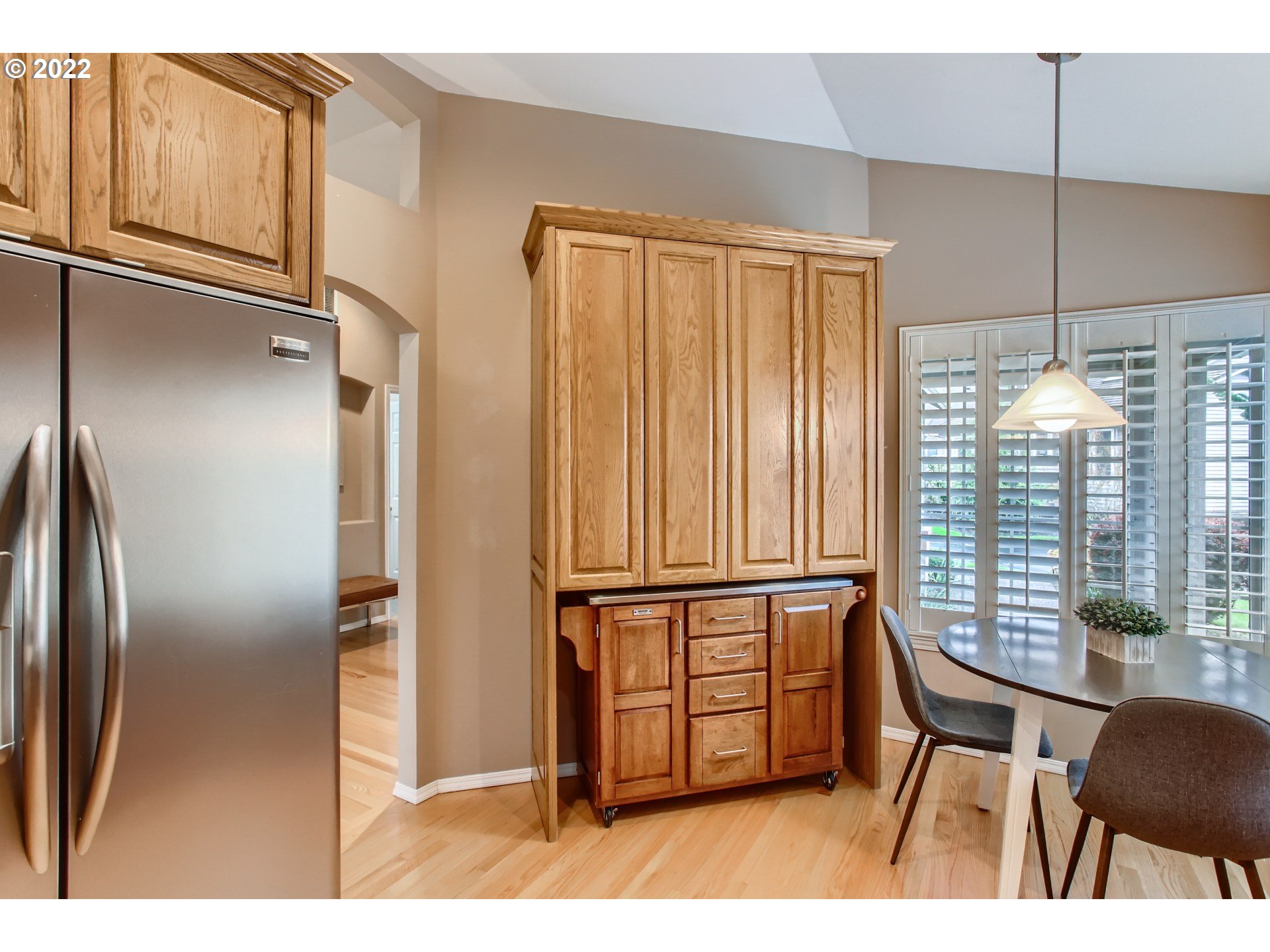 32504 Southwest Riviera Lane Wilsonville, OR 97070 - Photo 13 of 30 a kitchen with stainless steel appliances granite countertop a refrigerator and table chair