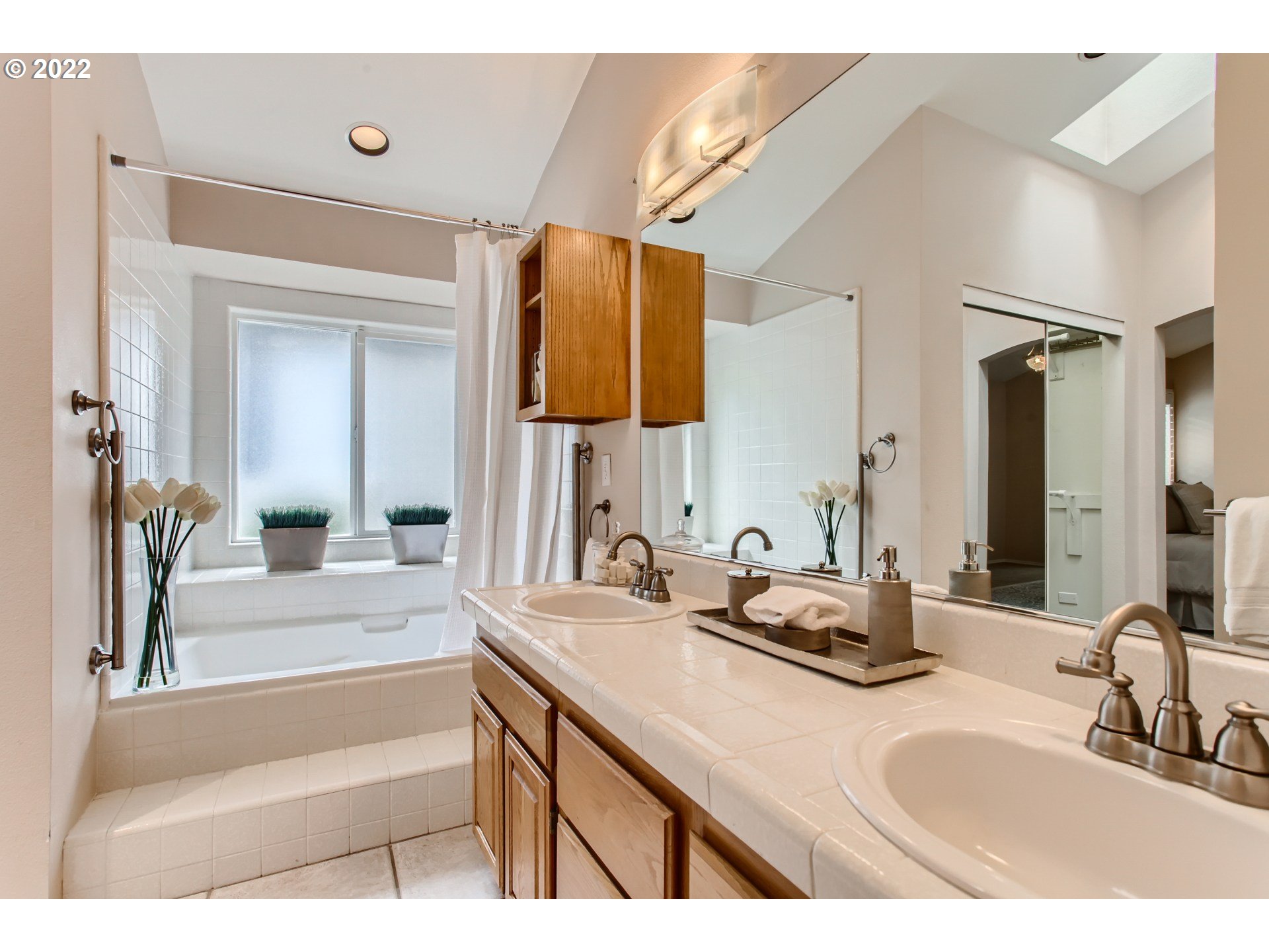 32504 Southwest Riviera Lane Wilsonville, OR 97070 - Photo 20 of 30 a bathroom with a granite countertop sink and a mirror