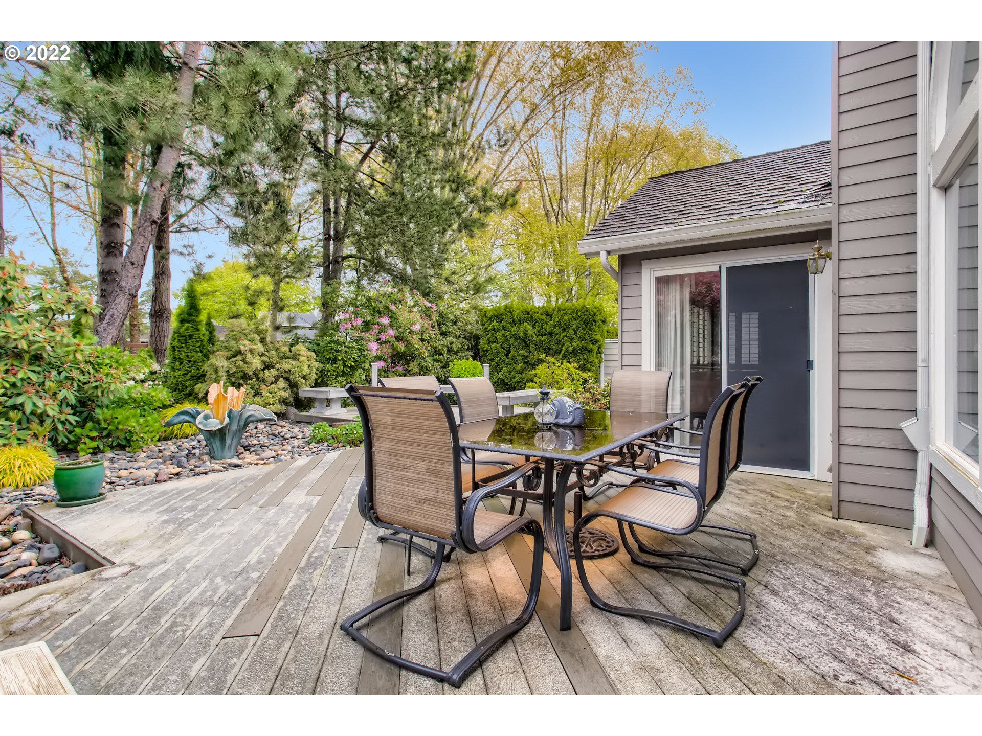 32504 Southwest Riviera Lane Wilsonville, OR 97070 - Photo 27 of 30 a view of a patio with table and chairs and potted plants