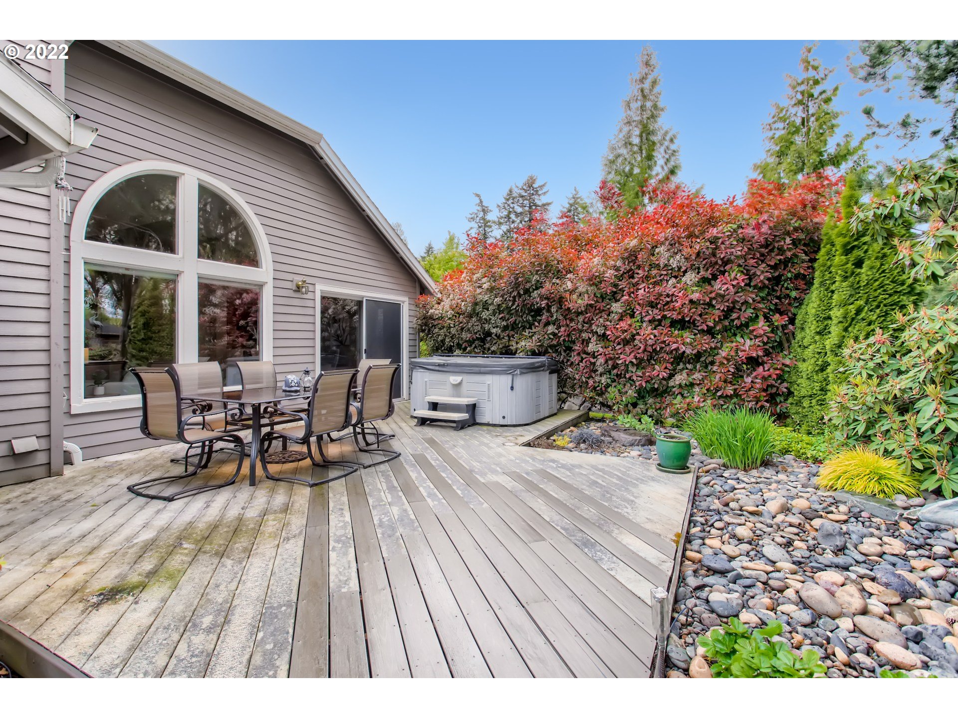 32504 Southwest Riviera Lane Wilsonville, OR 97070 - Photo 28 of 30 a view of a chairs and table on the wooden deck