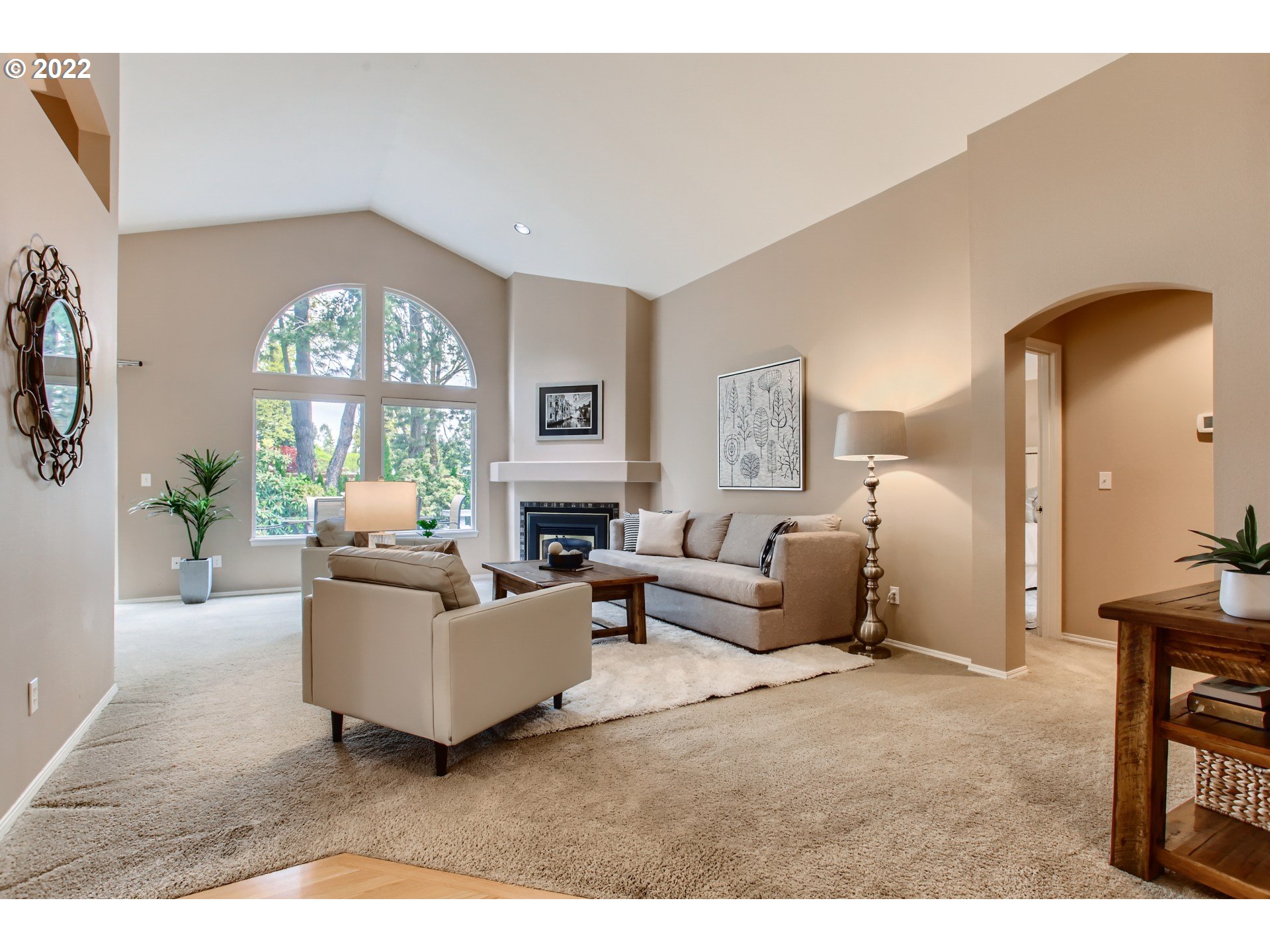 32504 Southwest Riviera Lane Wilsonville, OR 97070 - Photo 6 of 30 a living room with furniture a large window and a chandelier