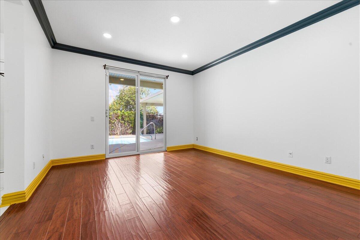 23732 Bella Vista Road Corona, CA 92883 - Photo 18 of 49 a view of room with window and wooden floor