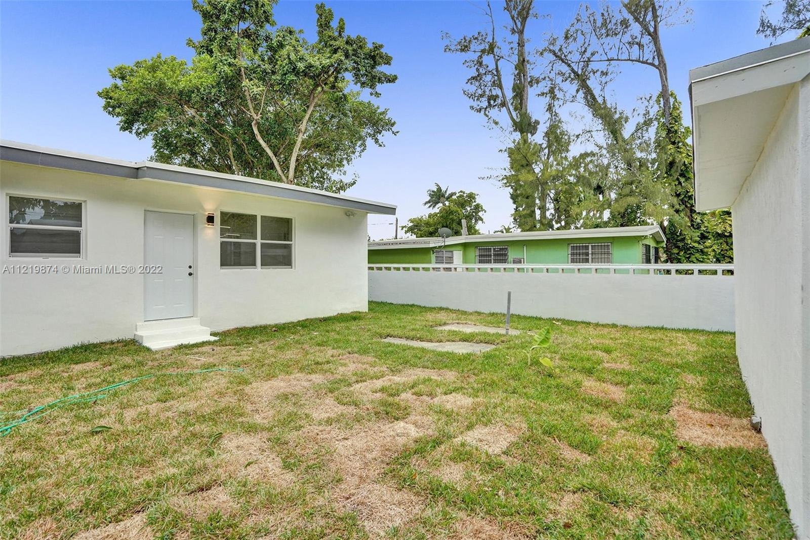 369 Northeast 158th Street Miami, FL 33162 - Photo 17 of 58 a view of an outdoor space and yard